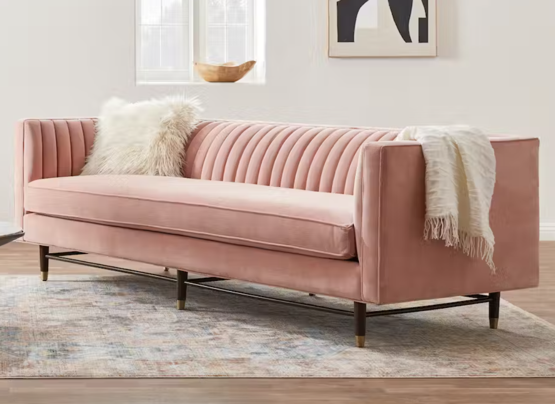 A pink sofa is shown