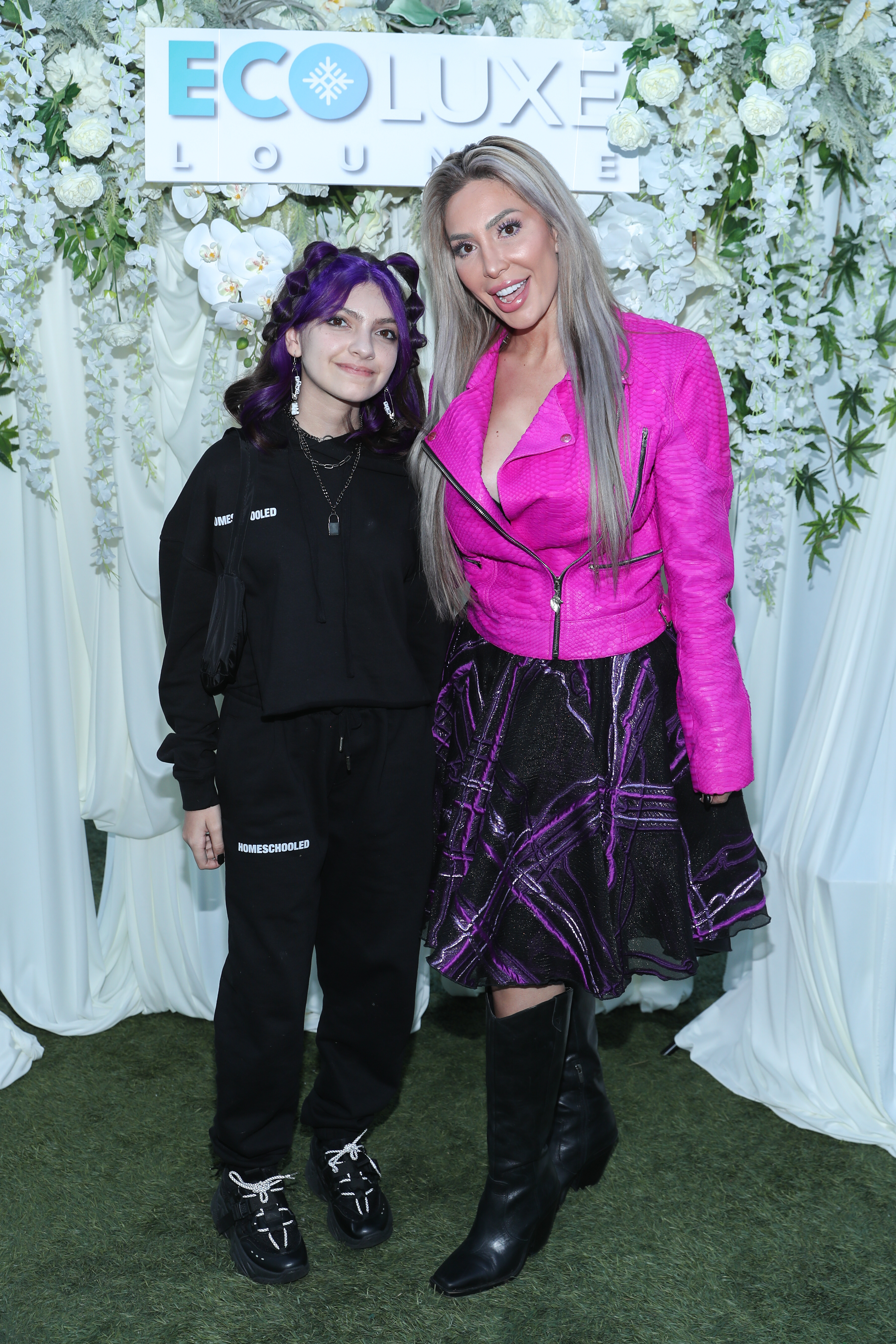 Farrah and Sophia posing for a photo at a media event