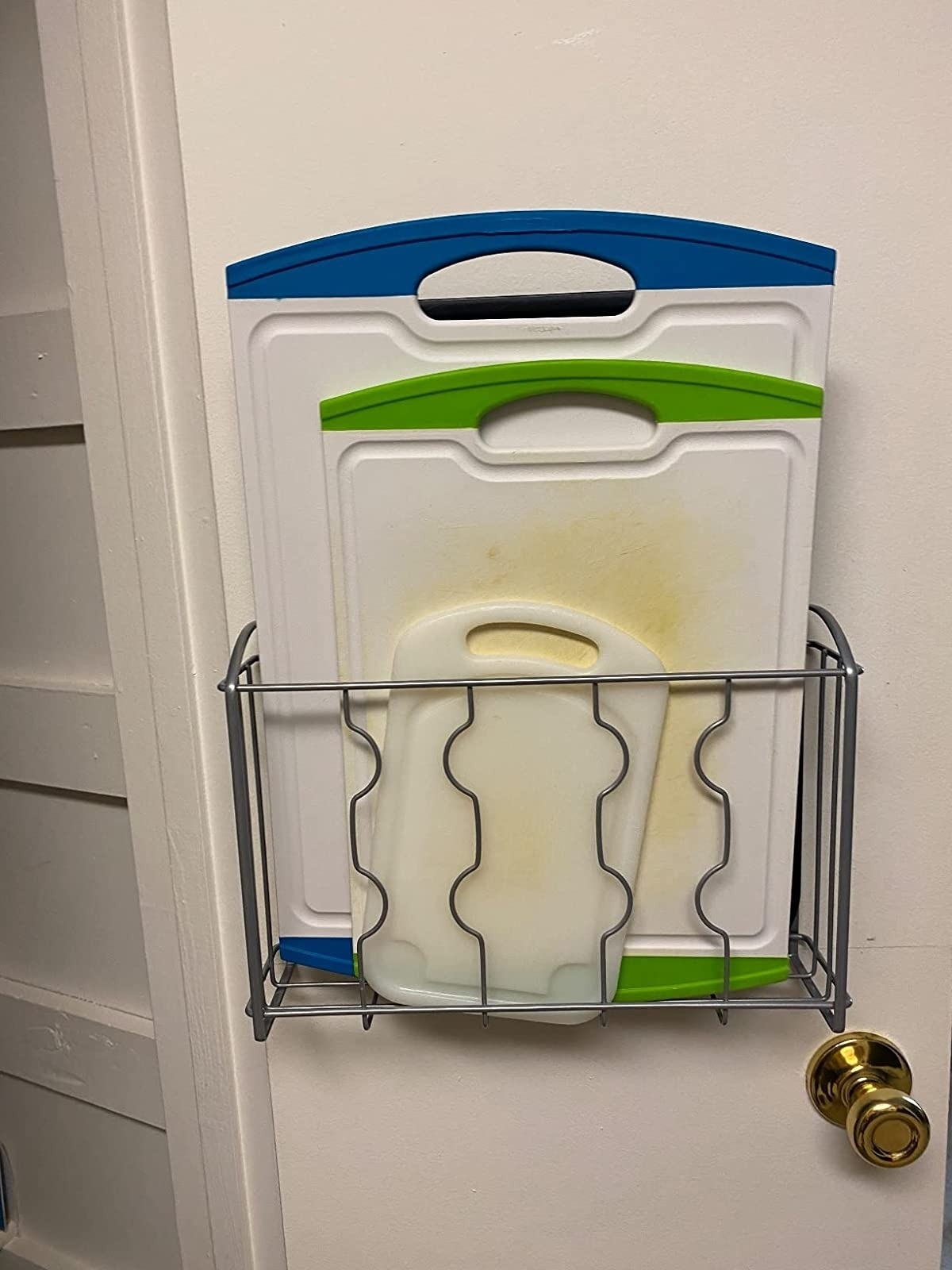Reviewer&#x27;s photo of cabinet organizer on a pantry door.