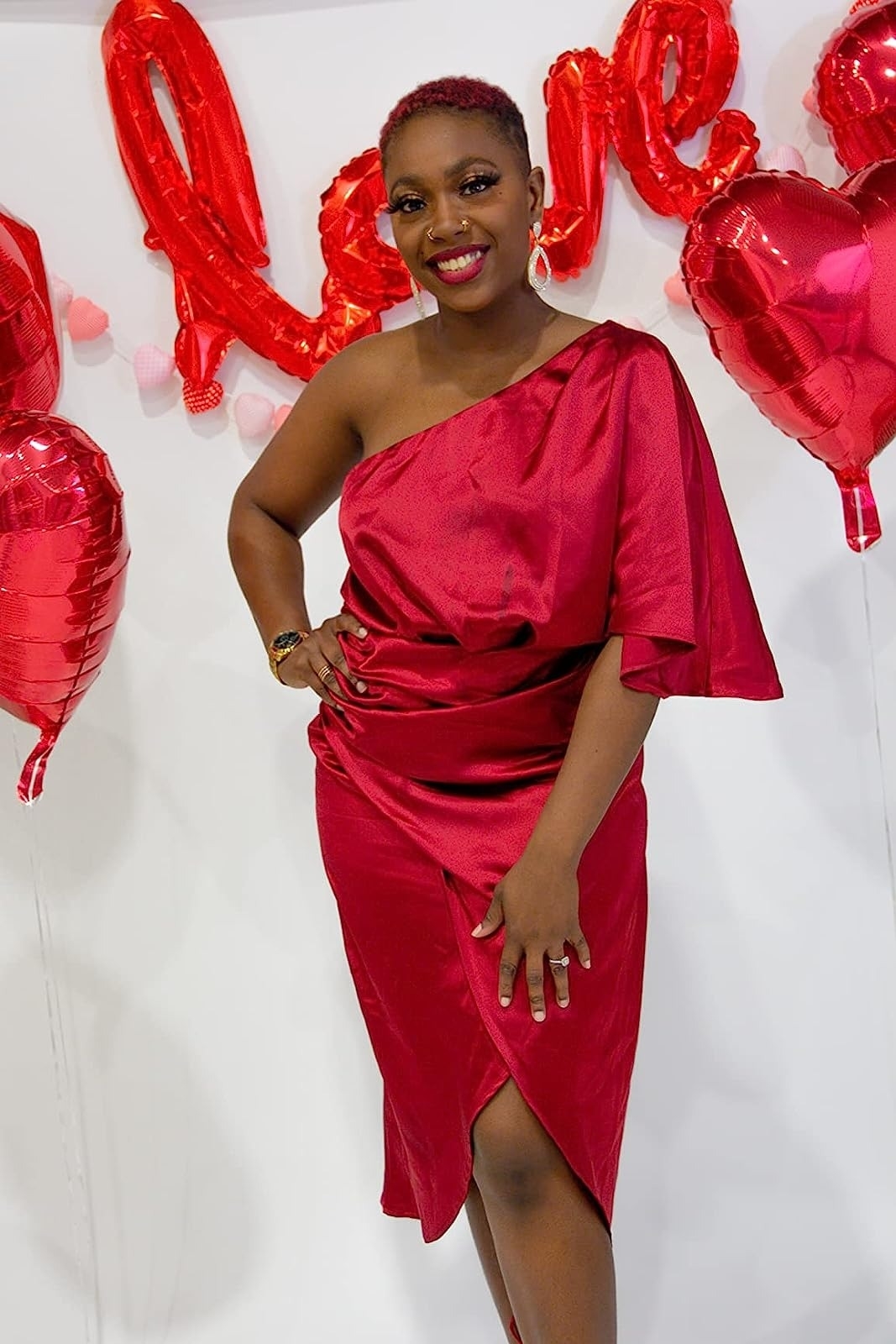 A reviewer in the red draped dress