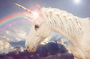 a unicorn with a rainbow coming out of its horn