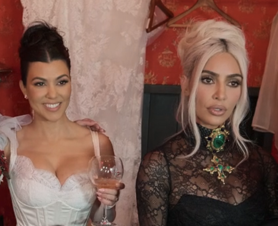 Closeup of Kourtney Kardashian and Kim Kardashian
