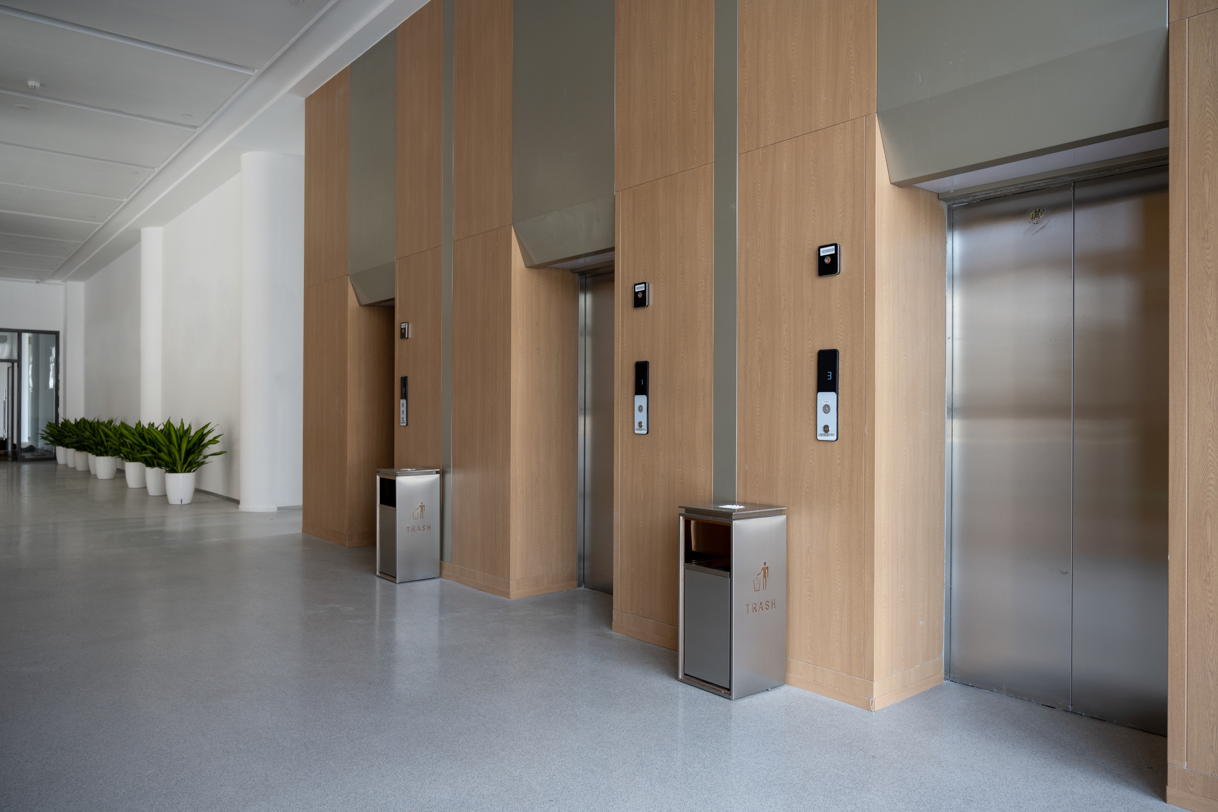 Three elevators with closed doors