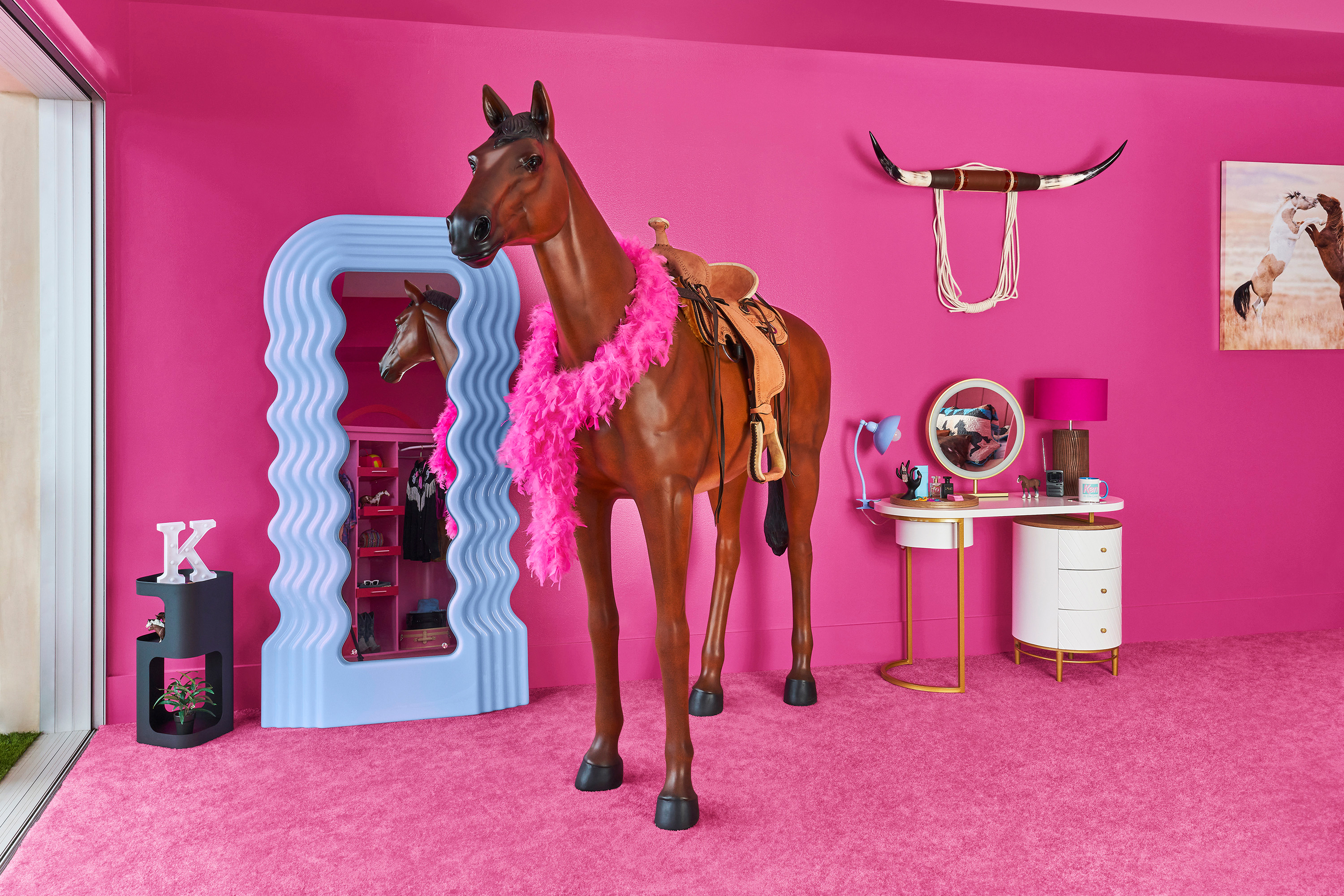 A lifesize horse figurine in front of a mirror