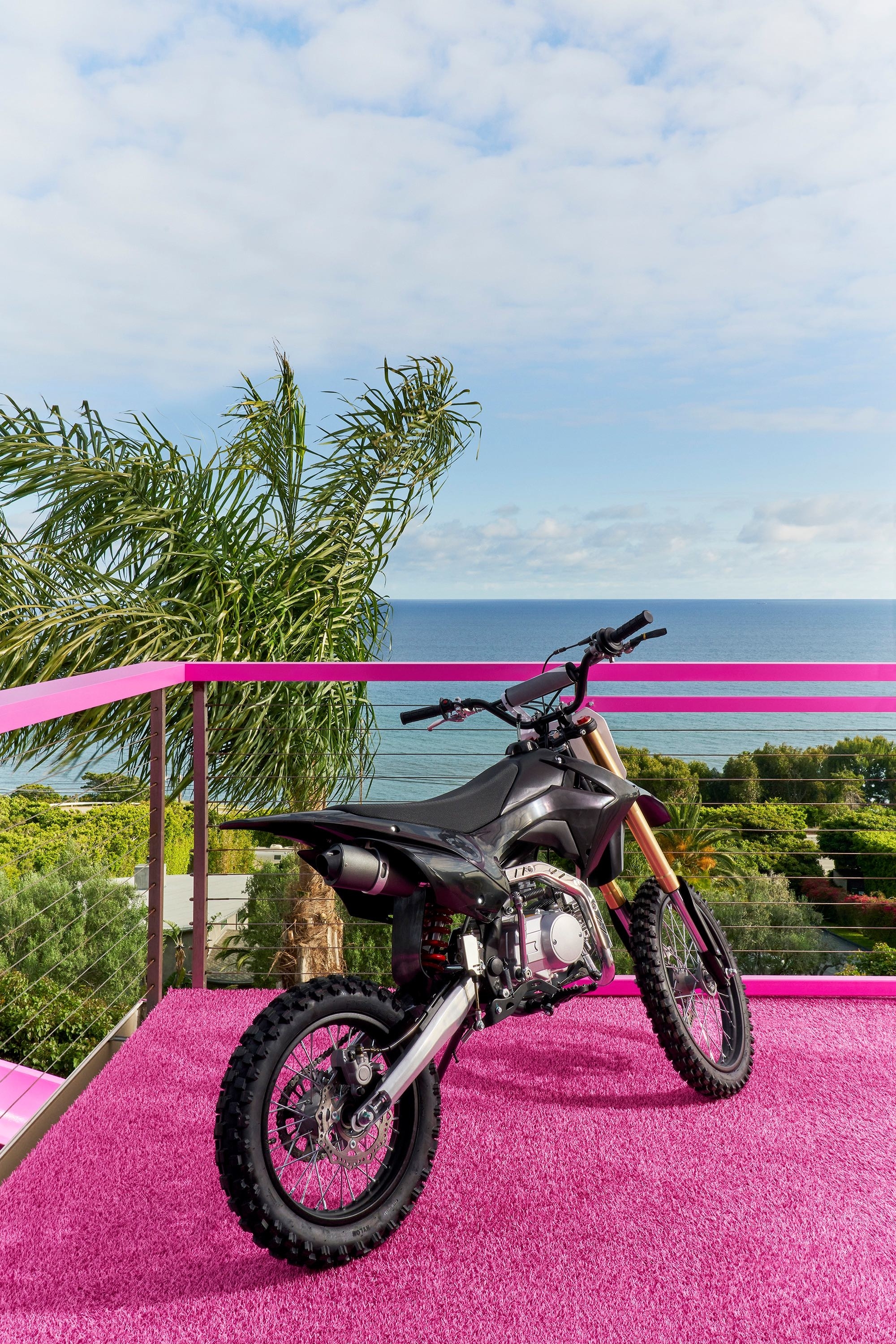 A motorcycle on the pink rooftop