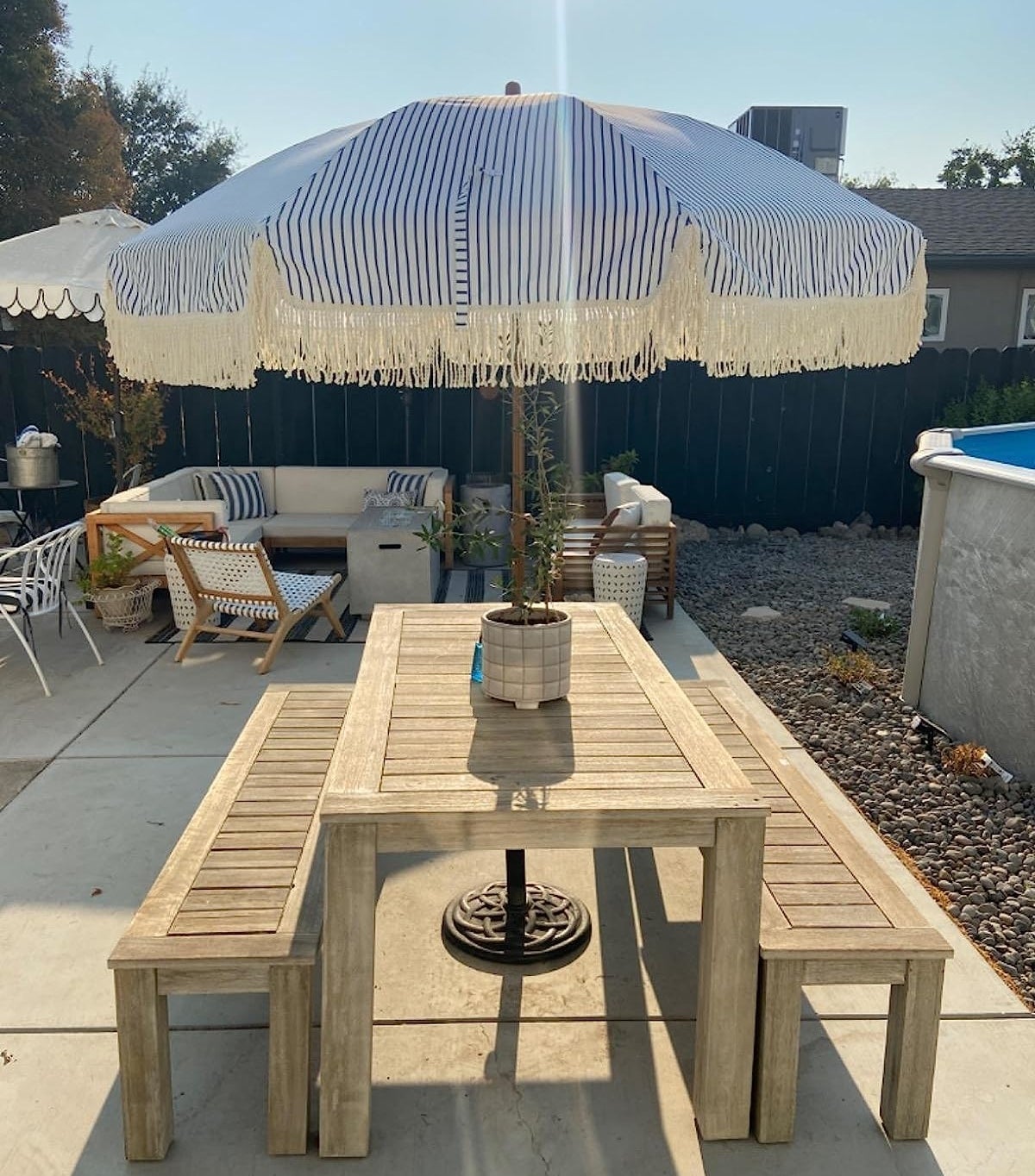 Reviewer image of the striped umbrella on their outdoor dining set