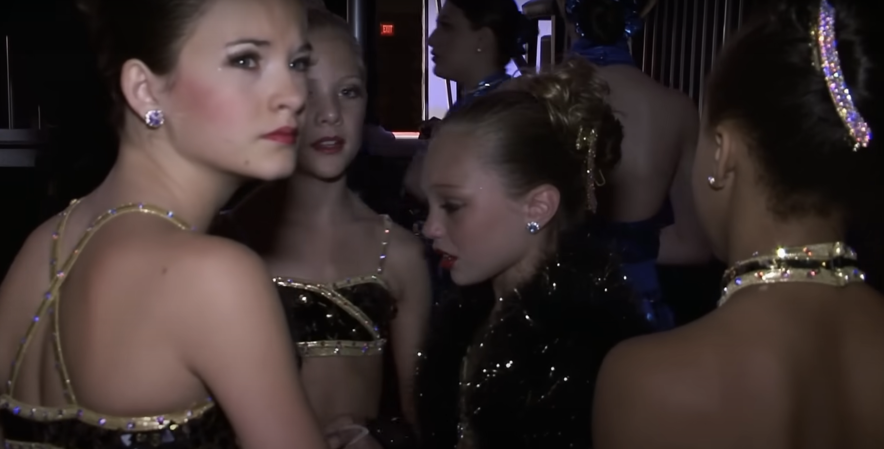 Close-up of Maddie with other young dancers