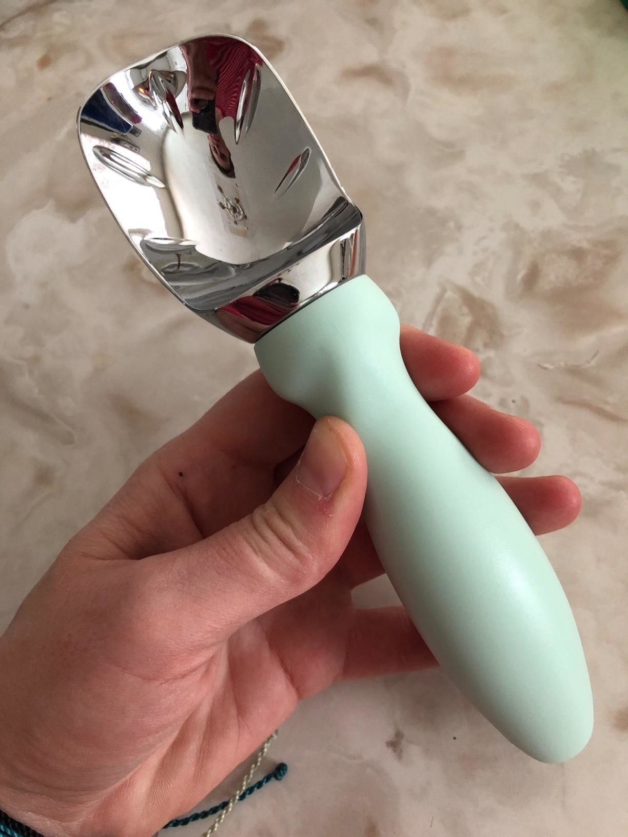 Reviewer holding the ice-cream scoop