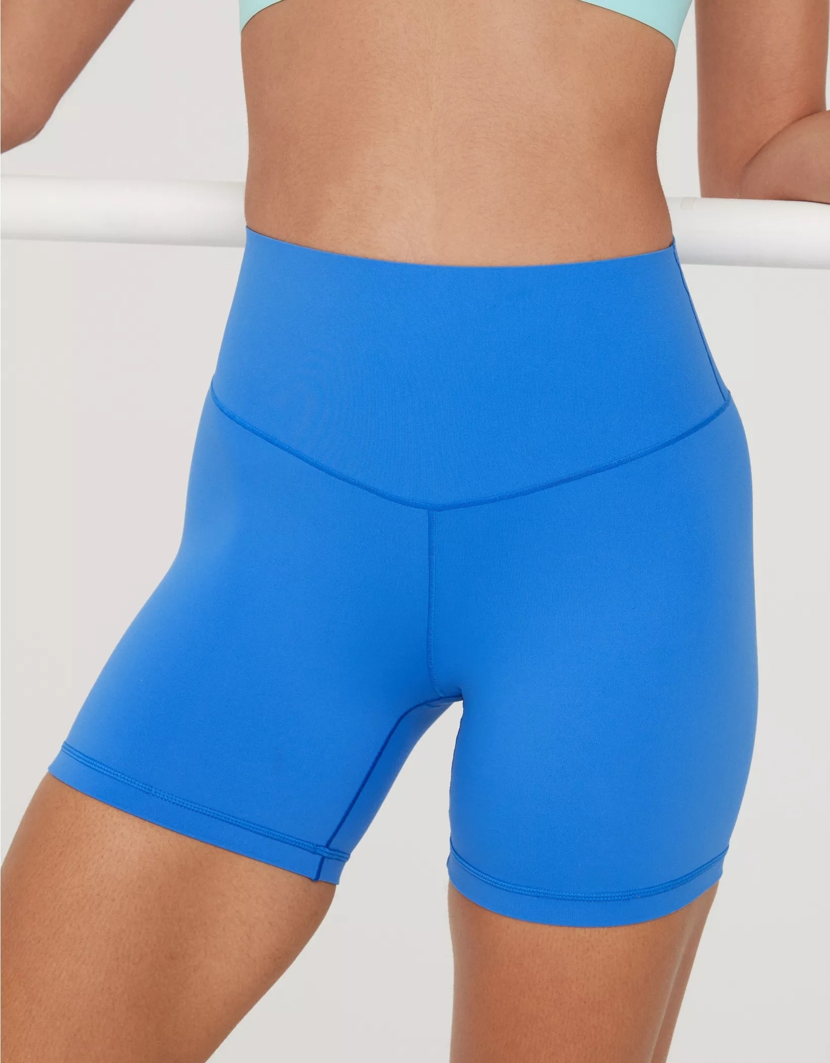 model wearing the blue shorts