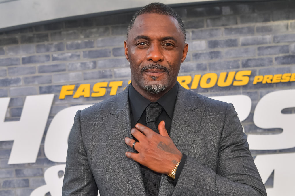 Close-up of Idris in a suit and tie