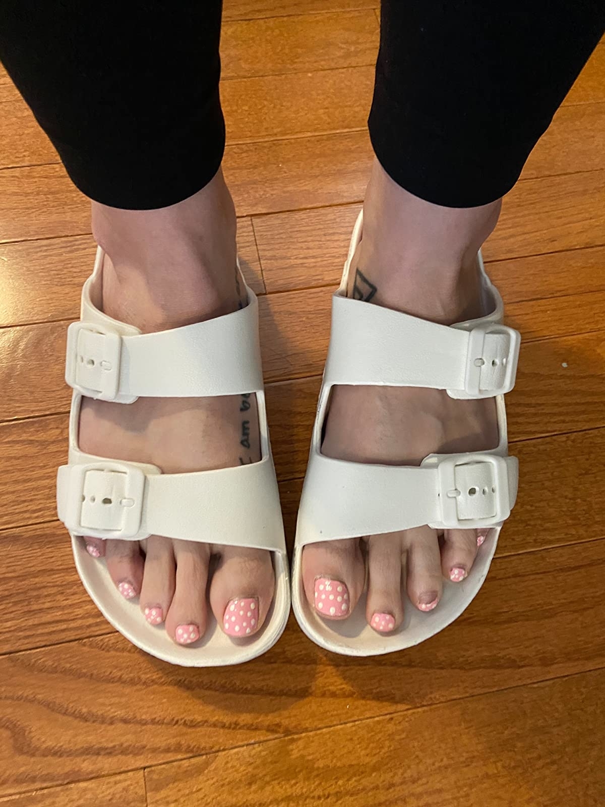 Reviewer wearing the cream slides