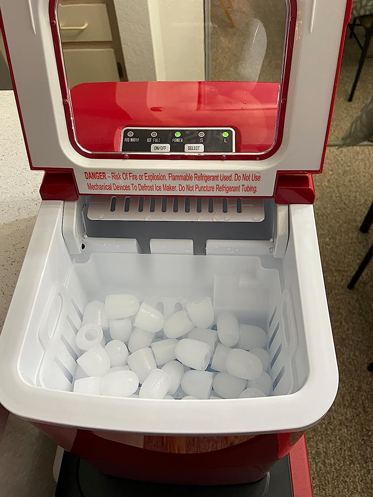 Reviewer image showing the open ice maker with ice cubes in it