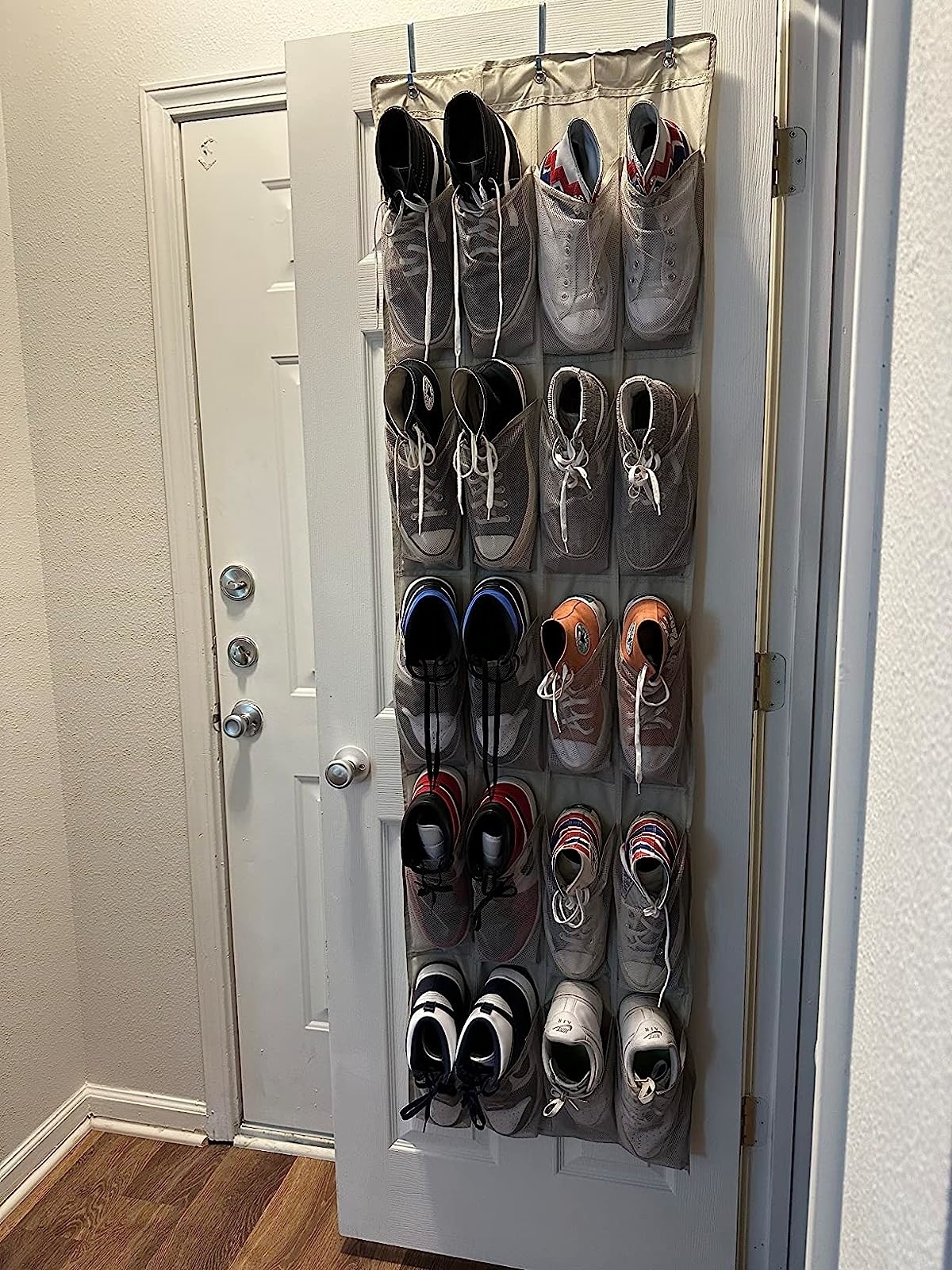 Reviewer image of the organizer filled with shoes hanging on their closet door