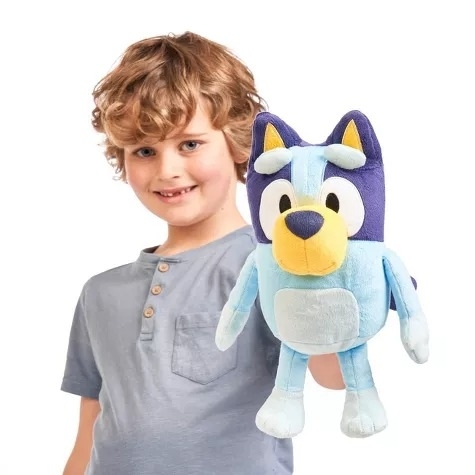 Kid holds a Bluey plush