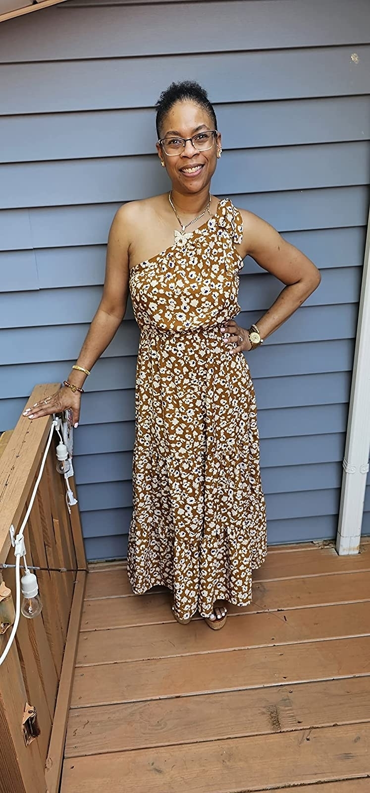 A reviewer in the mustard floral maxi