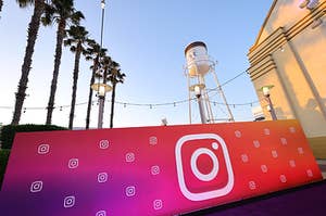 Instagram-branded signage in front of a water tower and palm trees in Anaheim, CA.