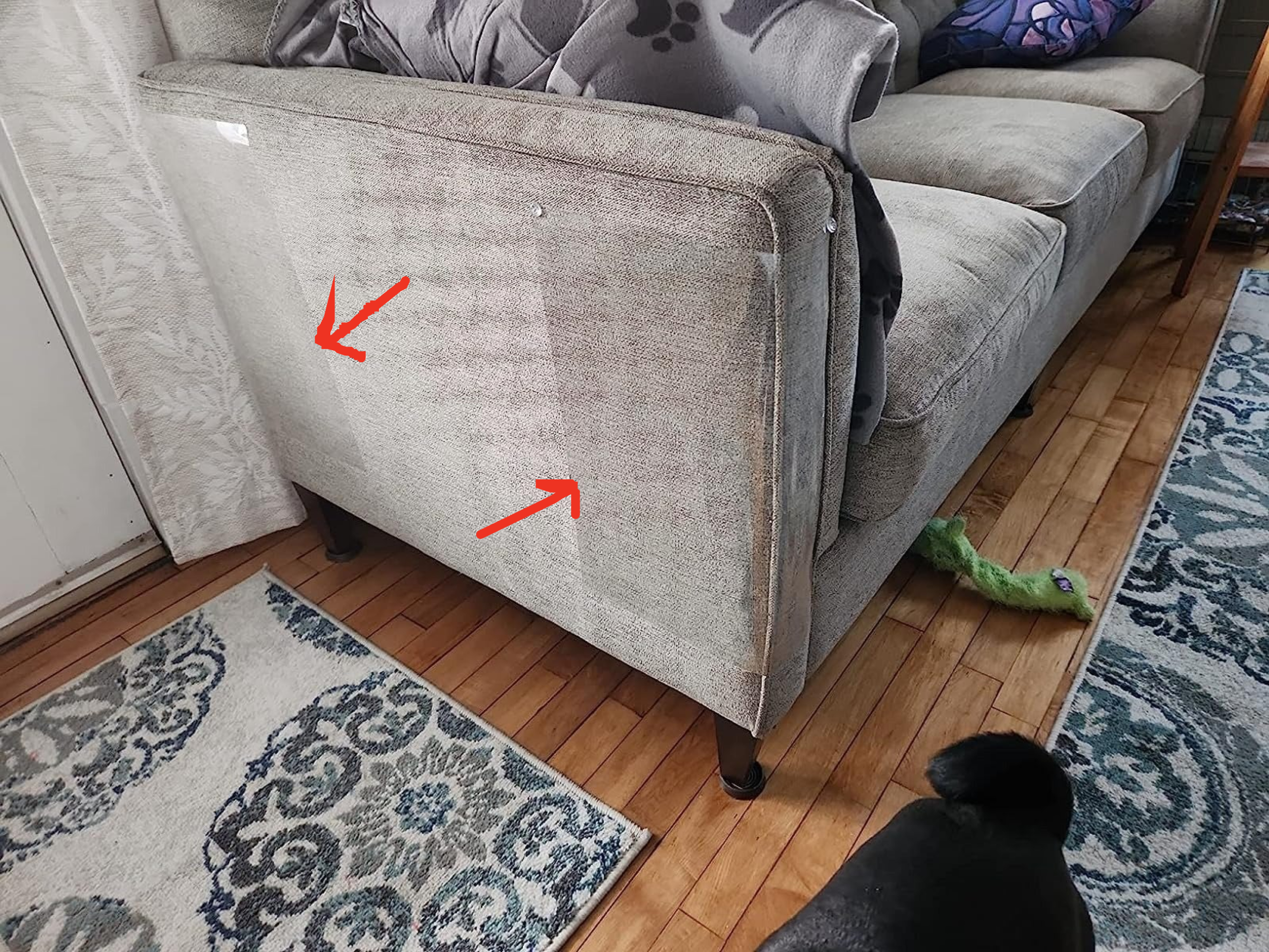 Reviewer&#x27;s photo of couch with protectors on it.