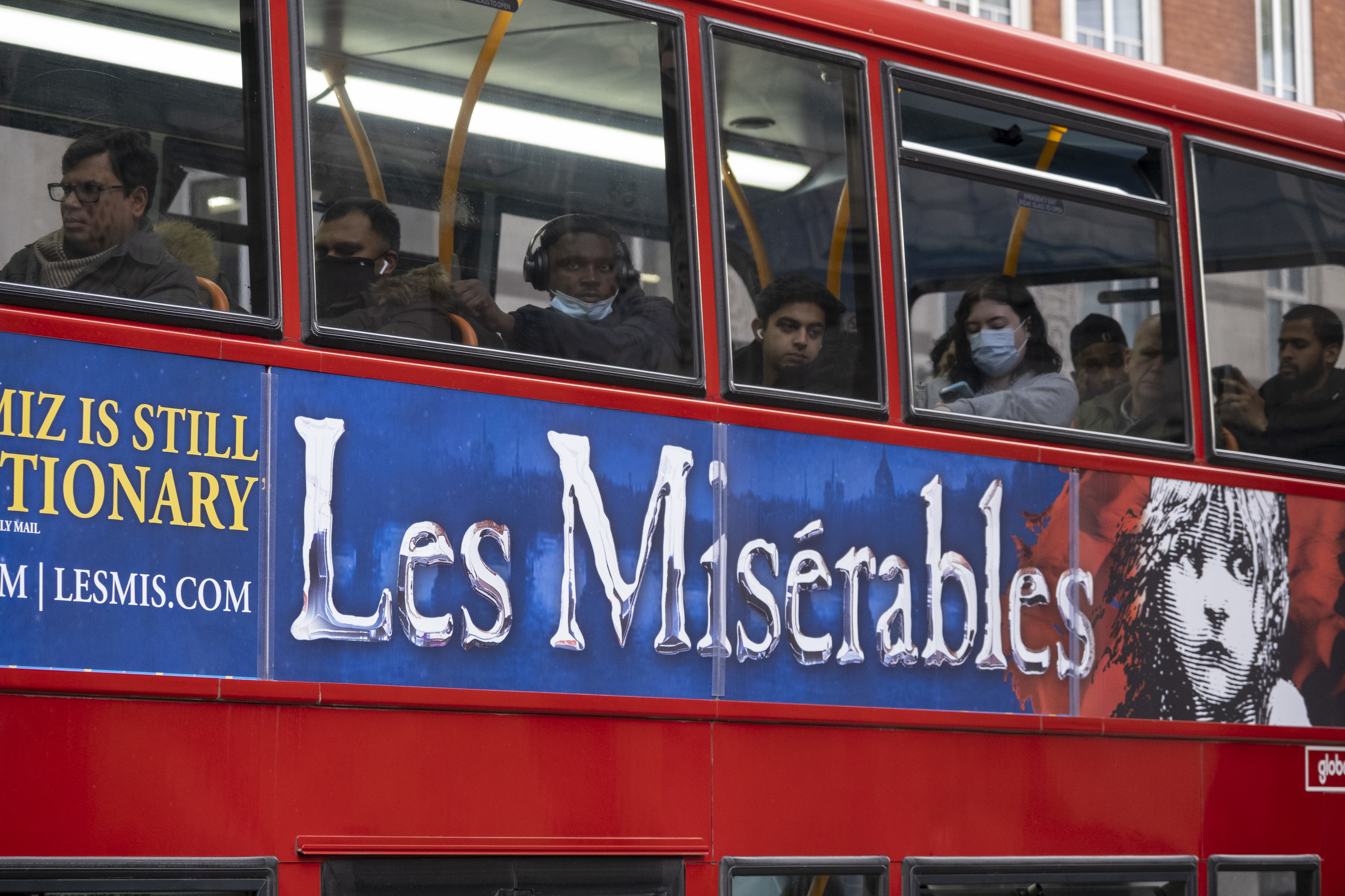 A bus with Les Misérables ad on it
