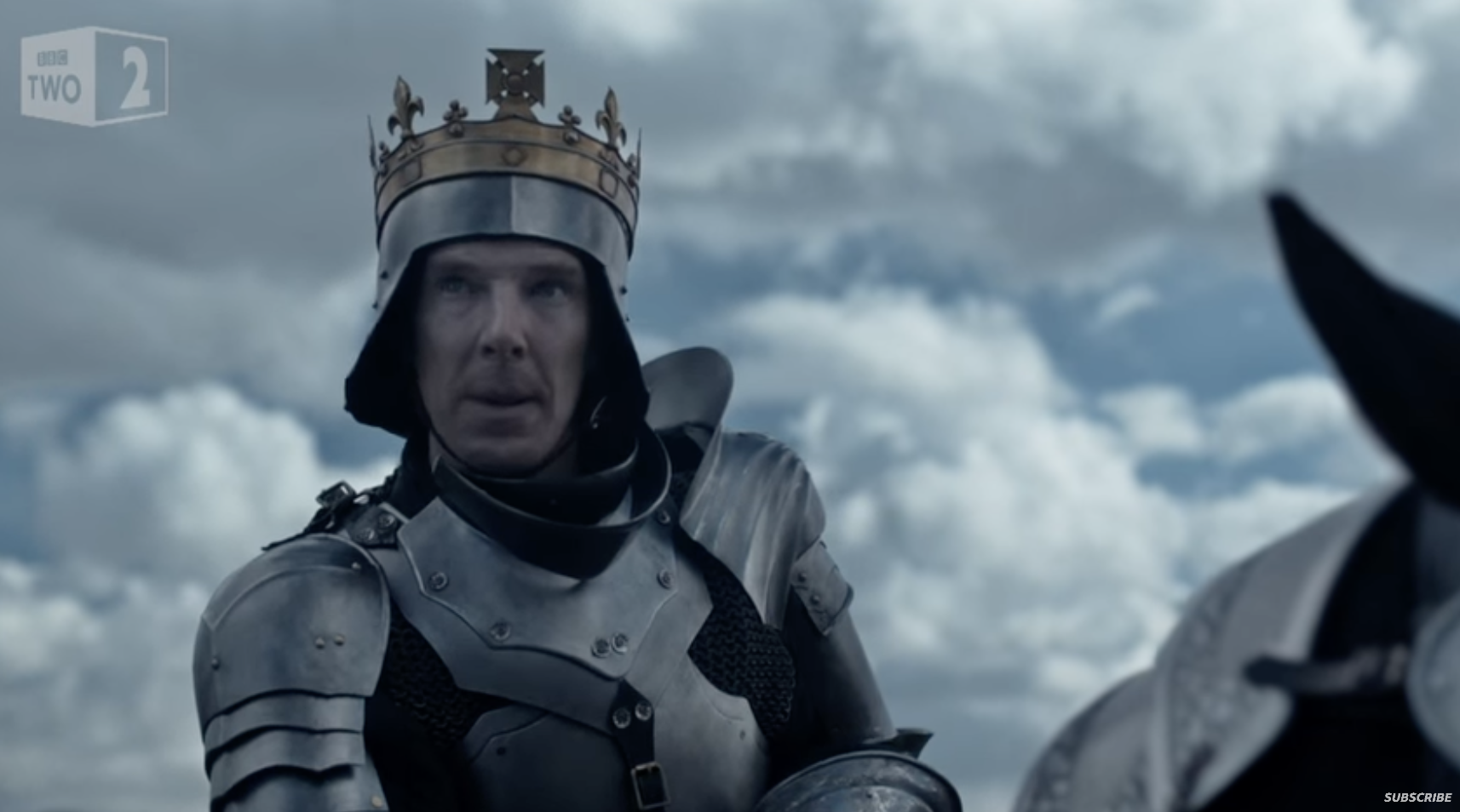 A screenshot of Benedict Cumberbatch portraying King Richard III, dressed in a suit of armor on a horse