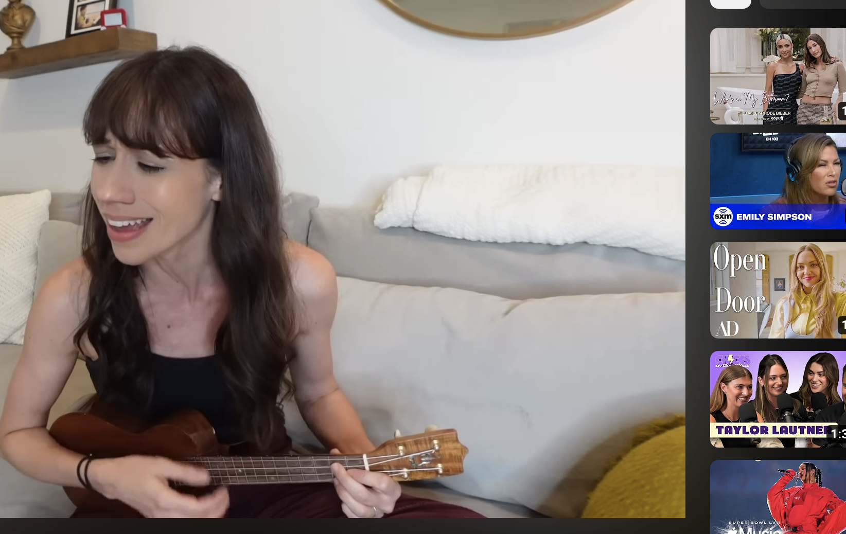 Colleen singing while playing ukulele