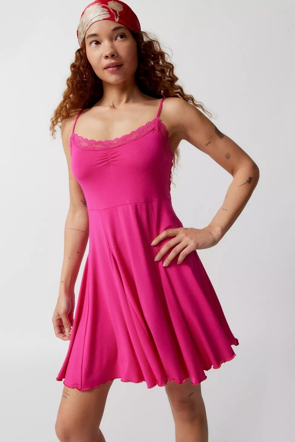 Model wearing lace trim mini dress in magenta