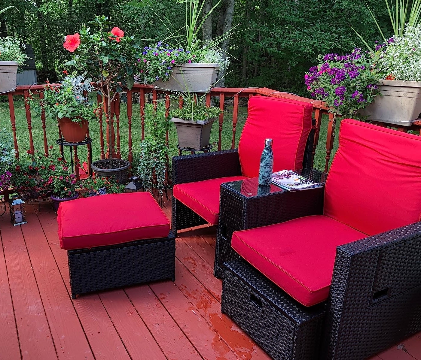 reviewer&#x27;s high-back chairs with storage ottomans with bright red cushions