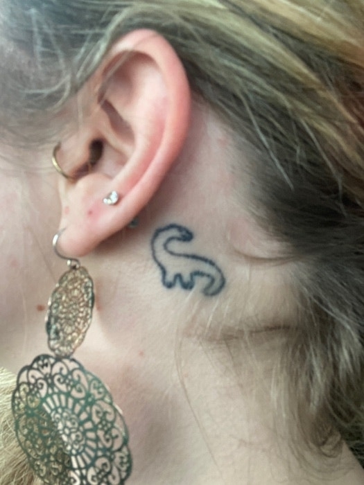 simba tattoo behind ear