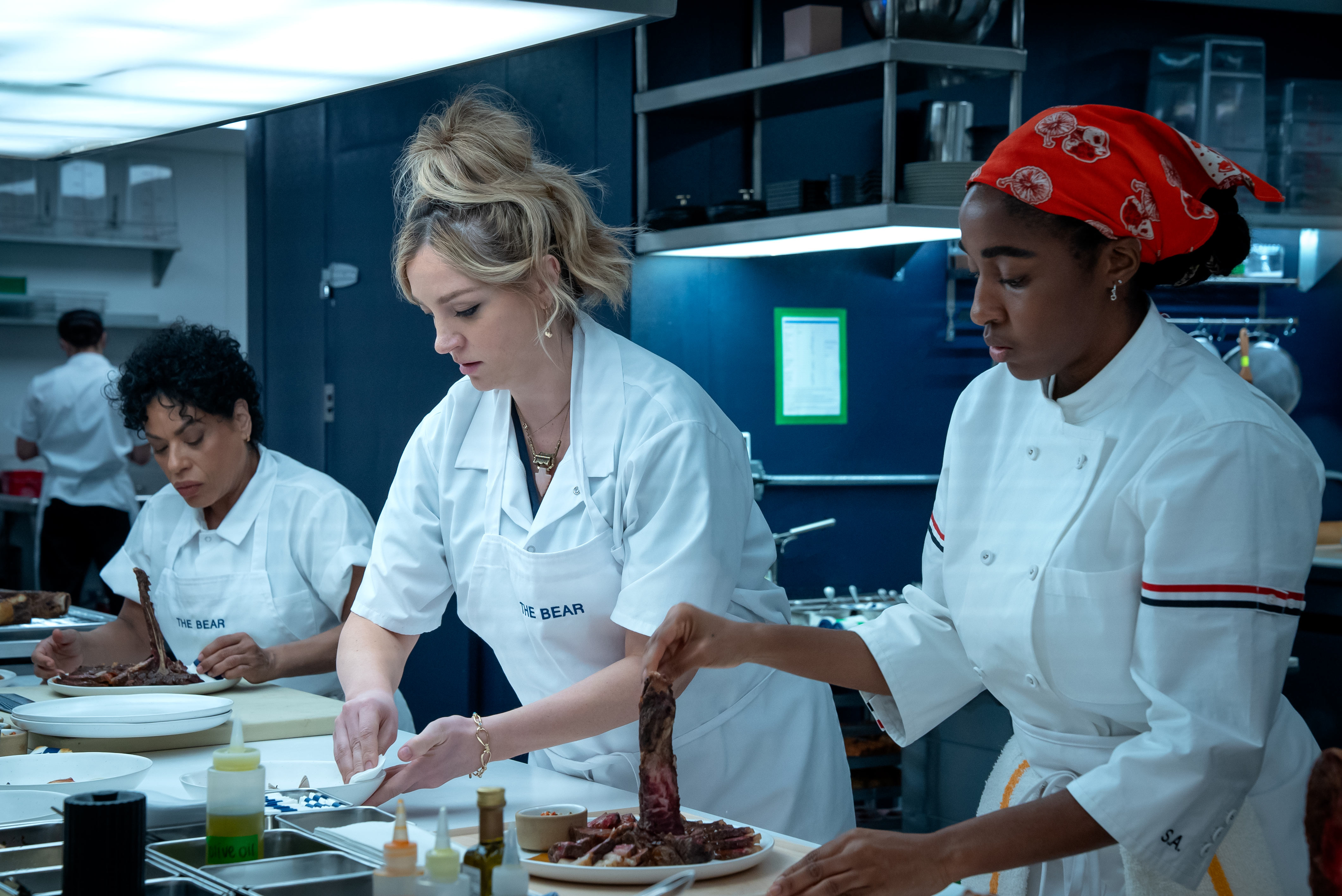 Abby with other cast members in the kitchen