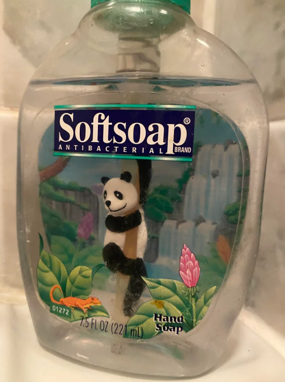Close-up of a Softsoap Hand Soap with a panda bear and alligator on the packaging