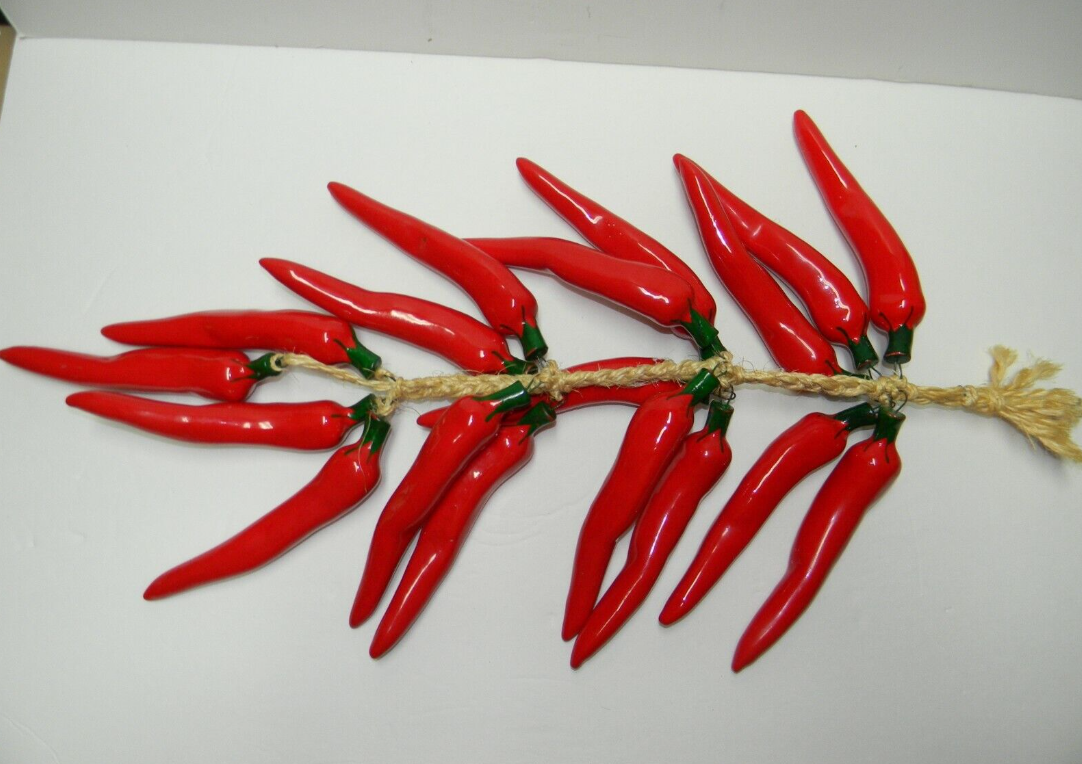 Close-up of a chili peppers–and–rope decoration