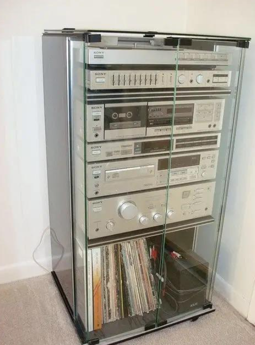 Close-up of stereo components and LPs in a glass cabinet