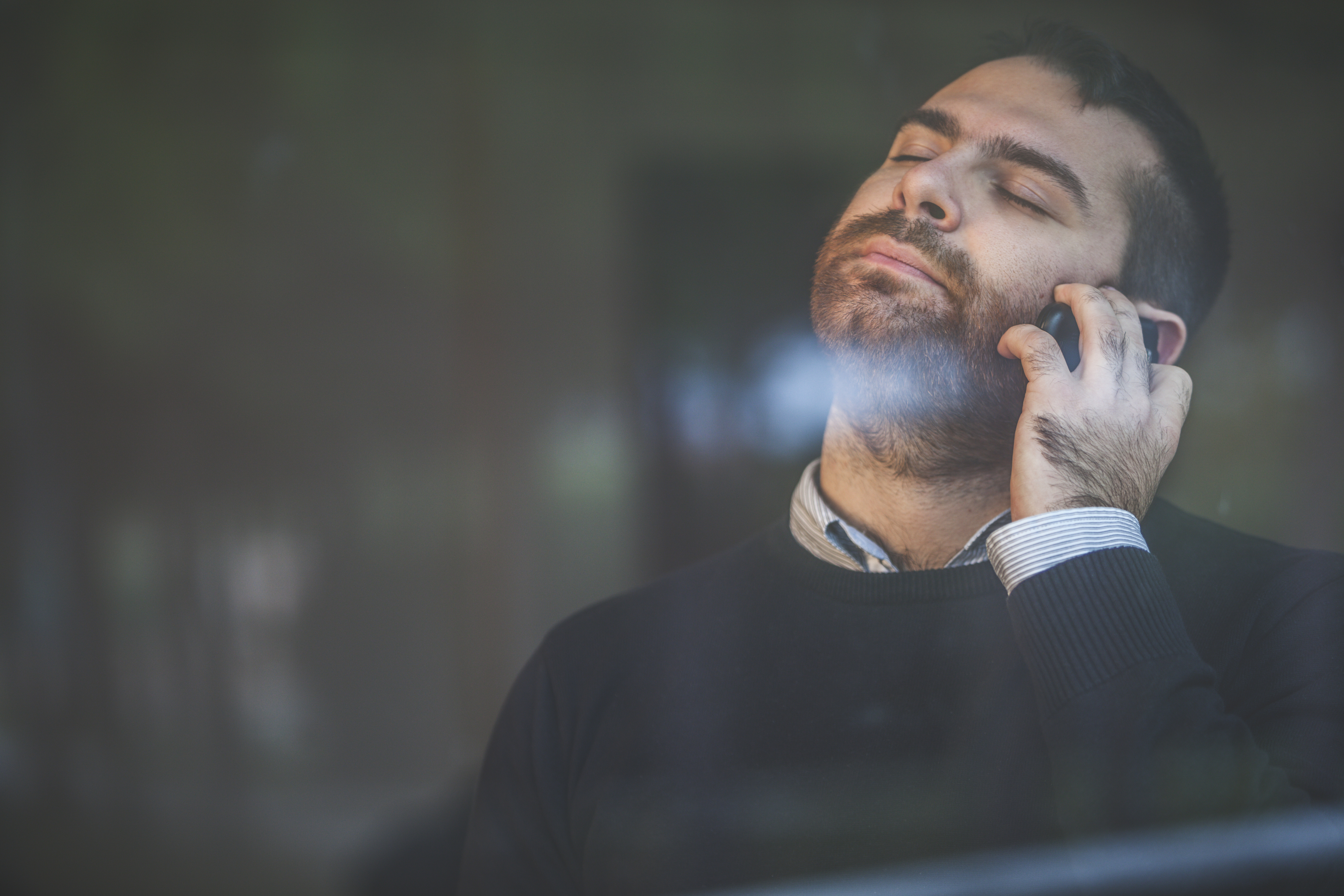 man stressed phone call