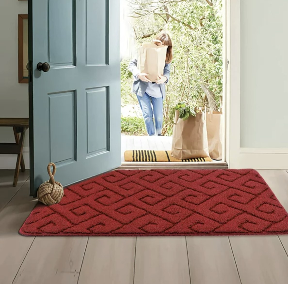 The doormat at the entrance of the house in red
