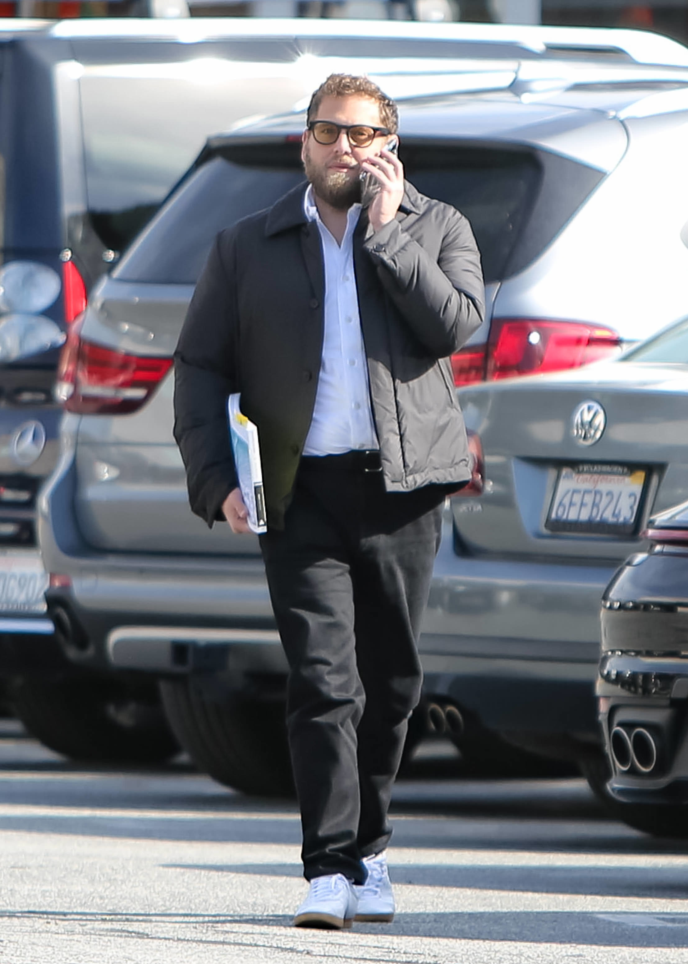 jonah on the phone in a parking lot