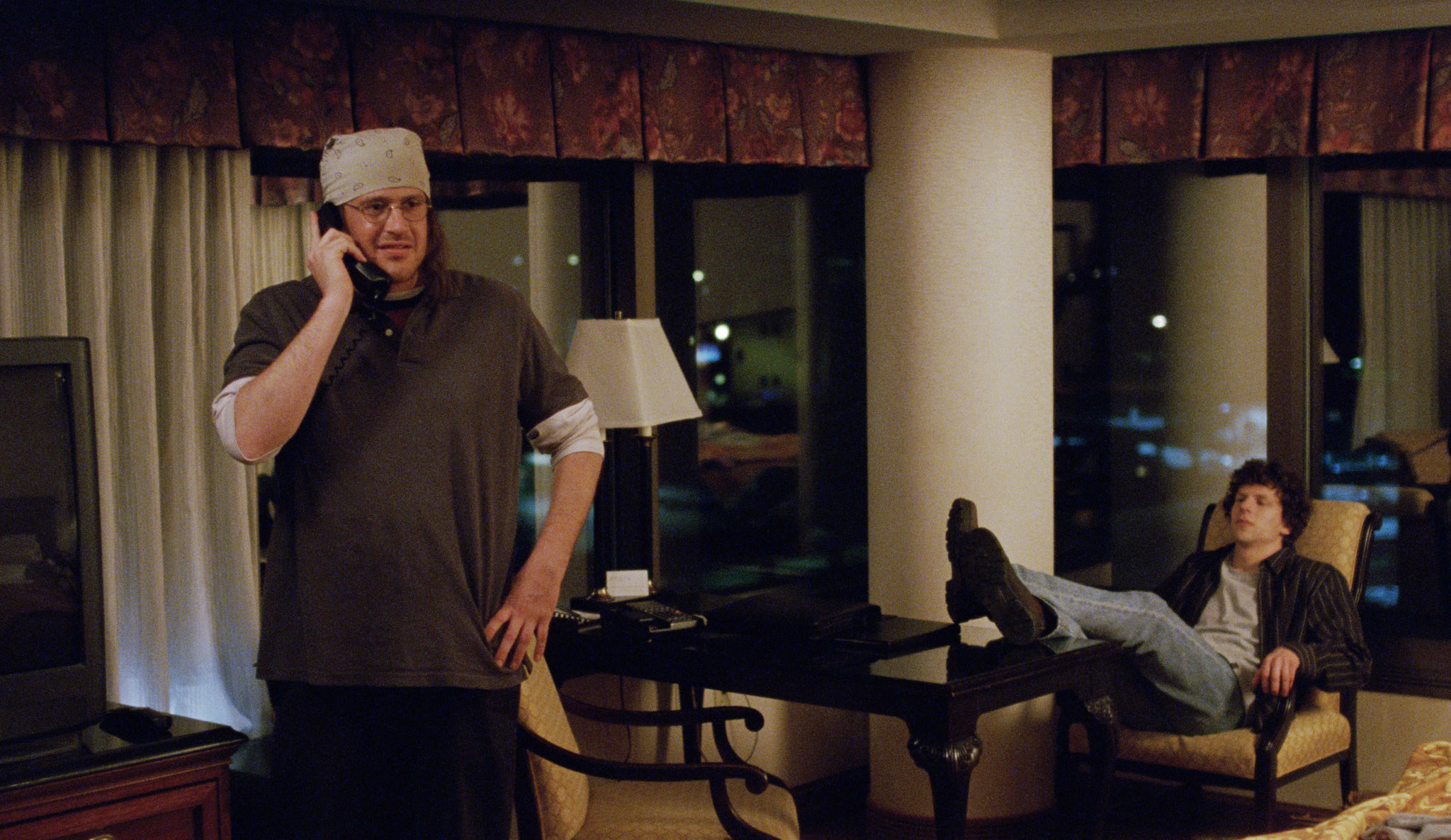 jason as david foster in a scene on the phone