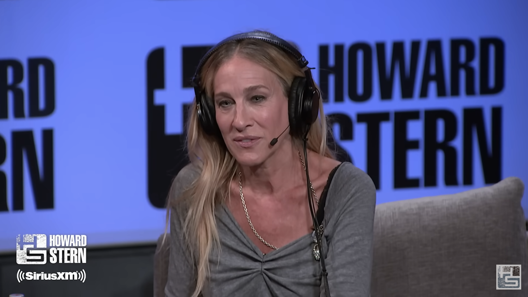 Close-up of SJP on the Howard Stern set, wearing headphones