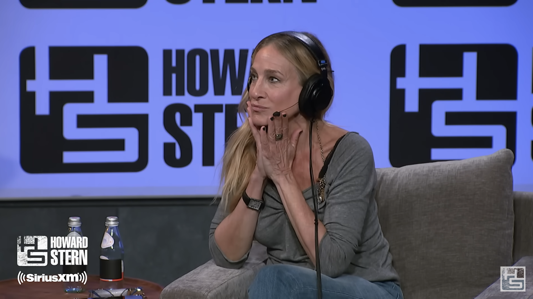 Close-up of SJP on the Howard Stern set, resting her chin in her hands