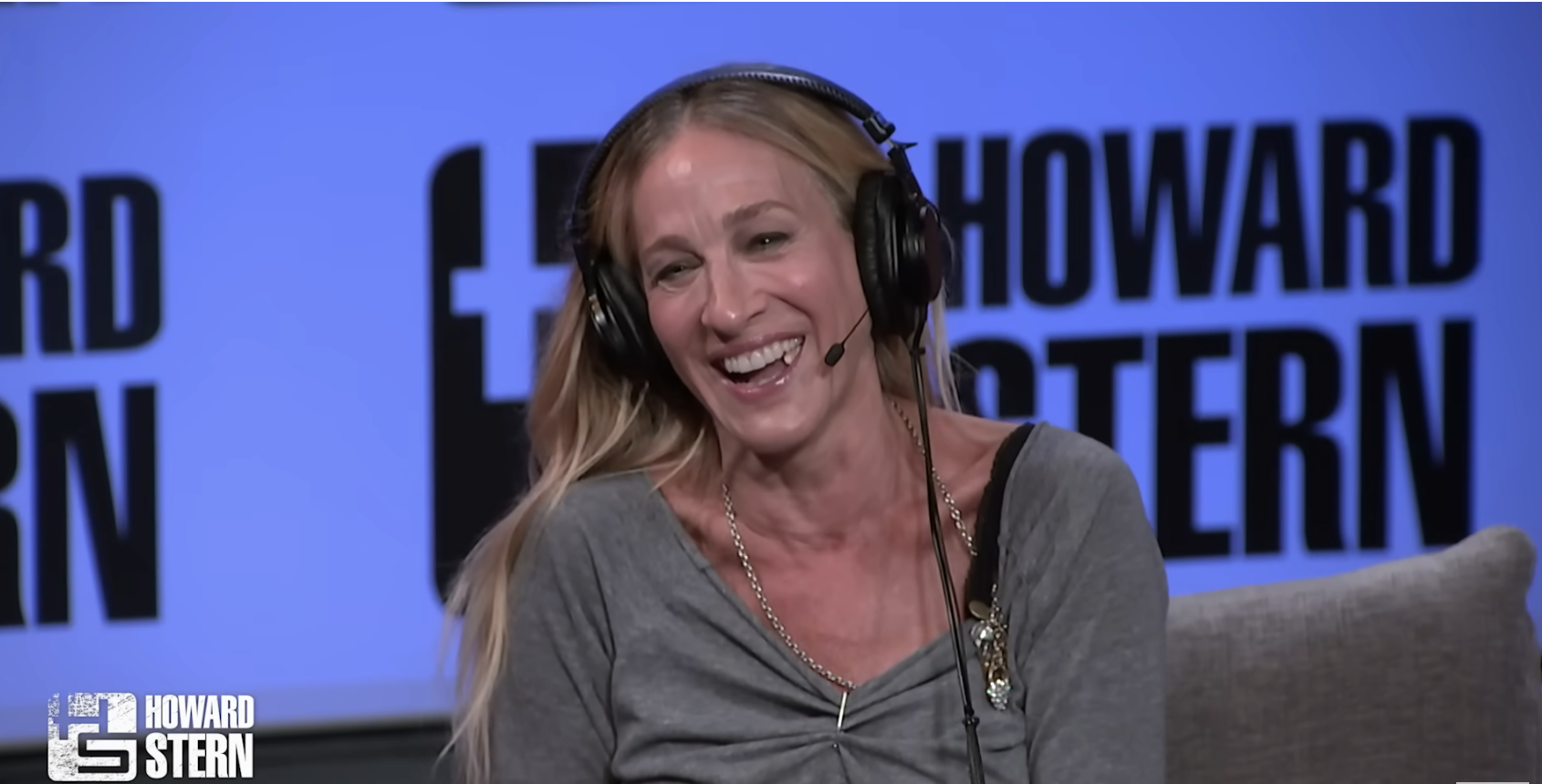 Close-up of SJP on the Howard Stern set smiling