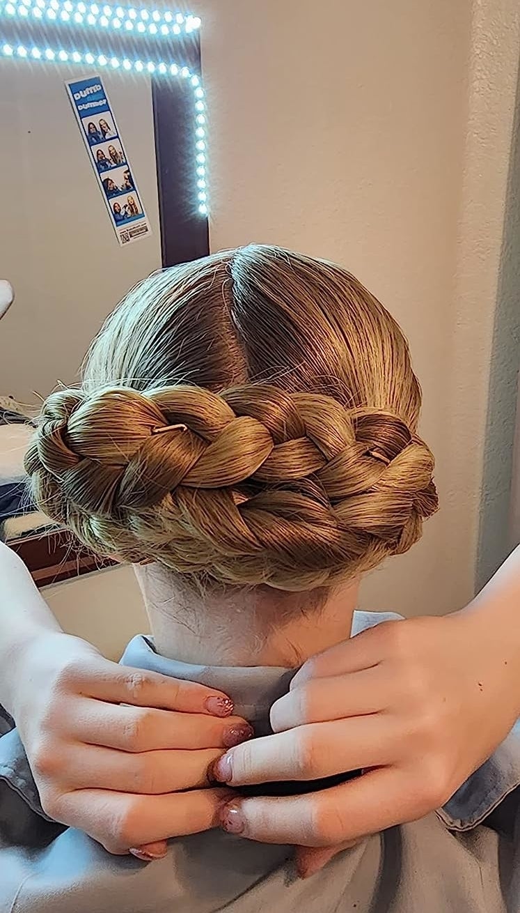 reviewer&#x27;s braided bun held with the pins