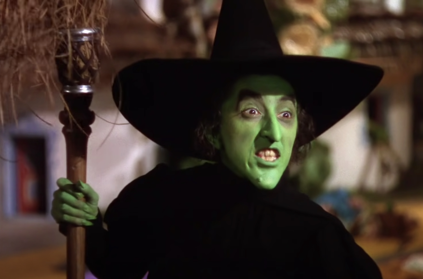 The Wicked Witch of the West holding a broom
