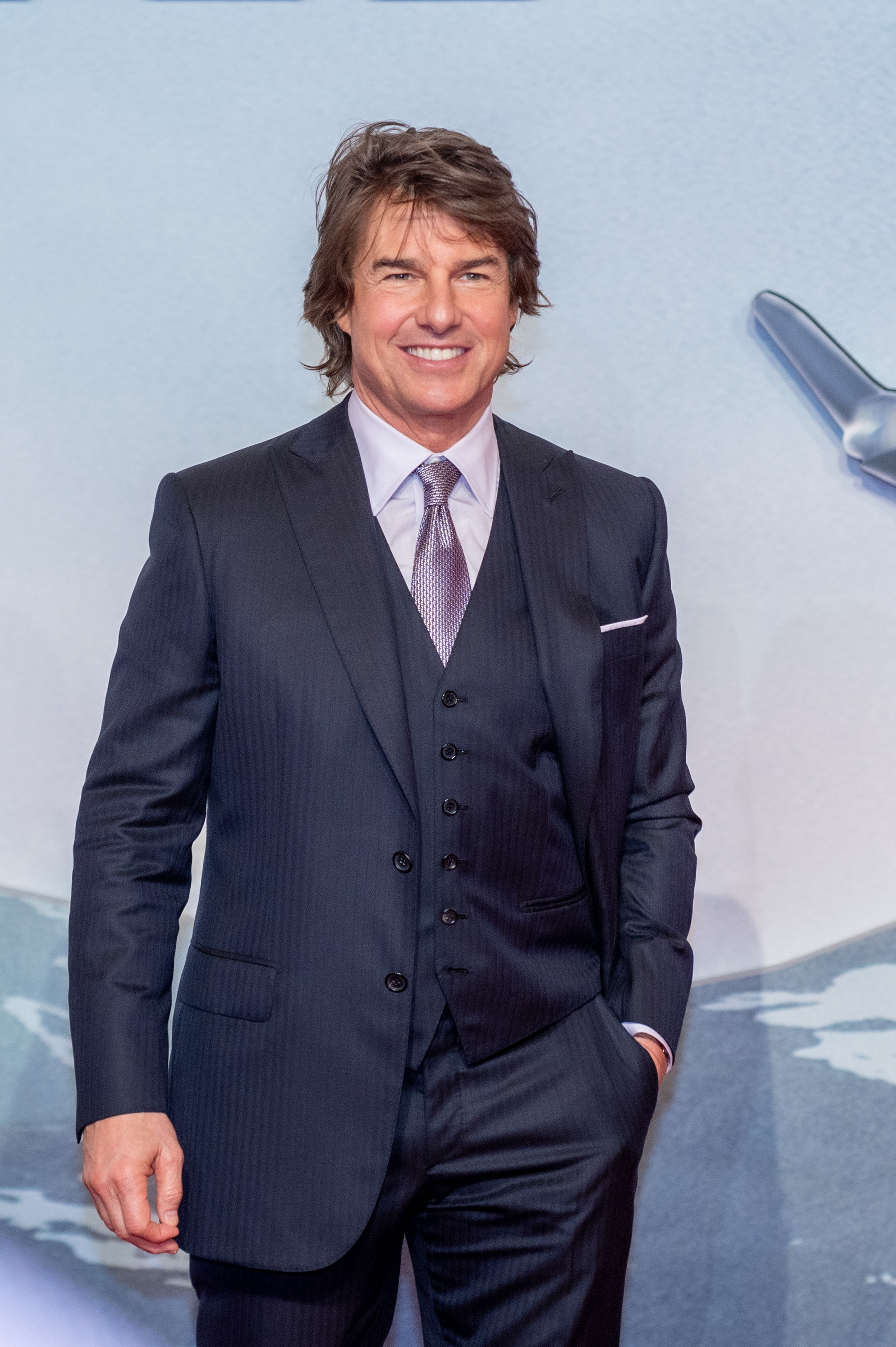 Tom Cruise on the red carpet in a suit and tie