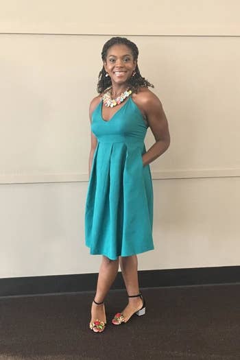 reviewer wearing the dress in blue
