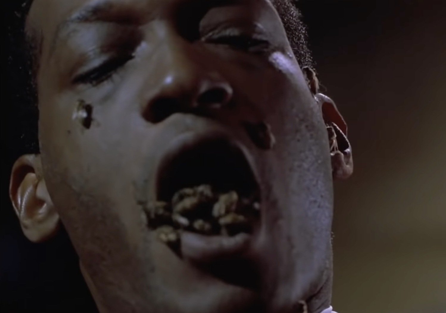 The Candyman with bees in his mouth