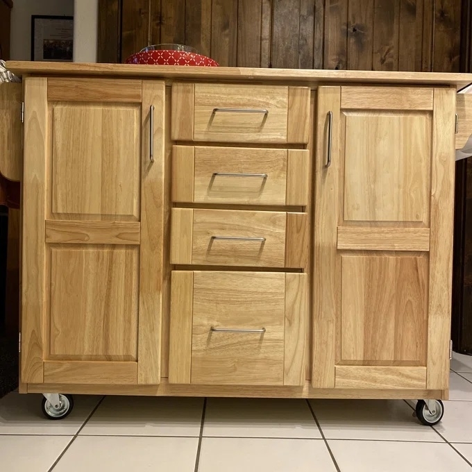 A brown kitchen island in a reviewer&#x27;s home