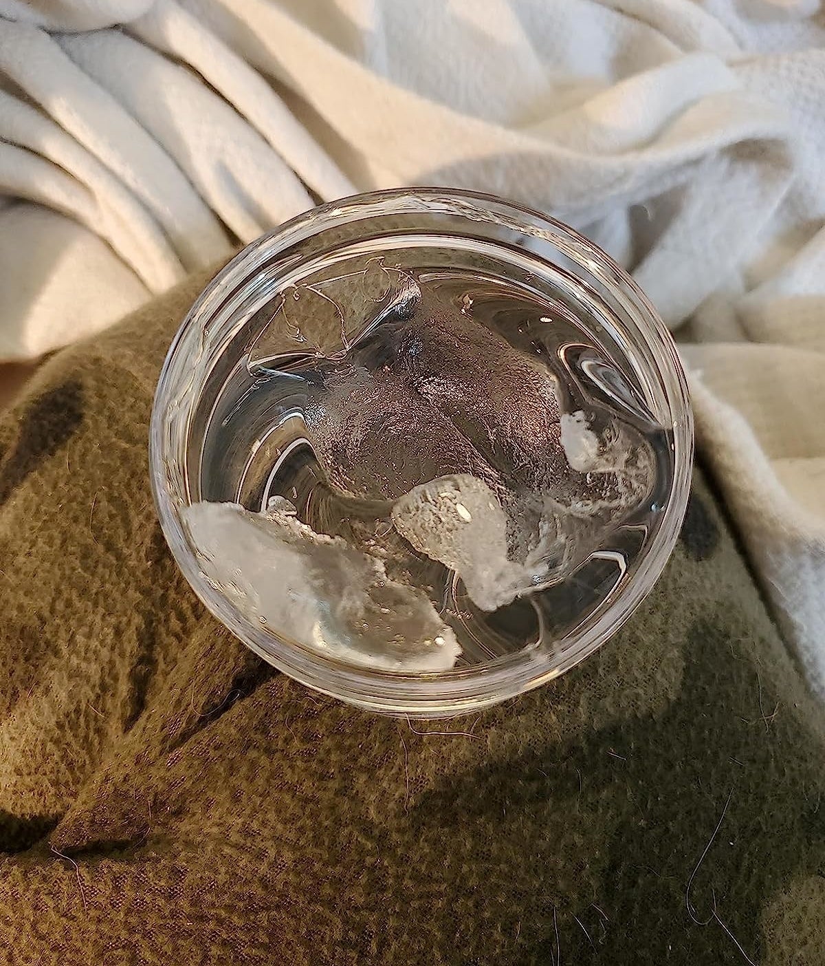 a reviewer photo of the clear tub of gel