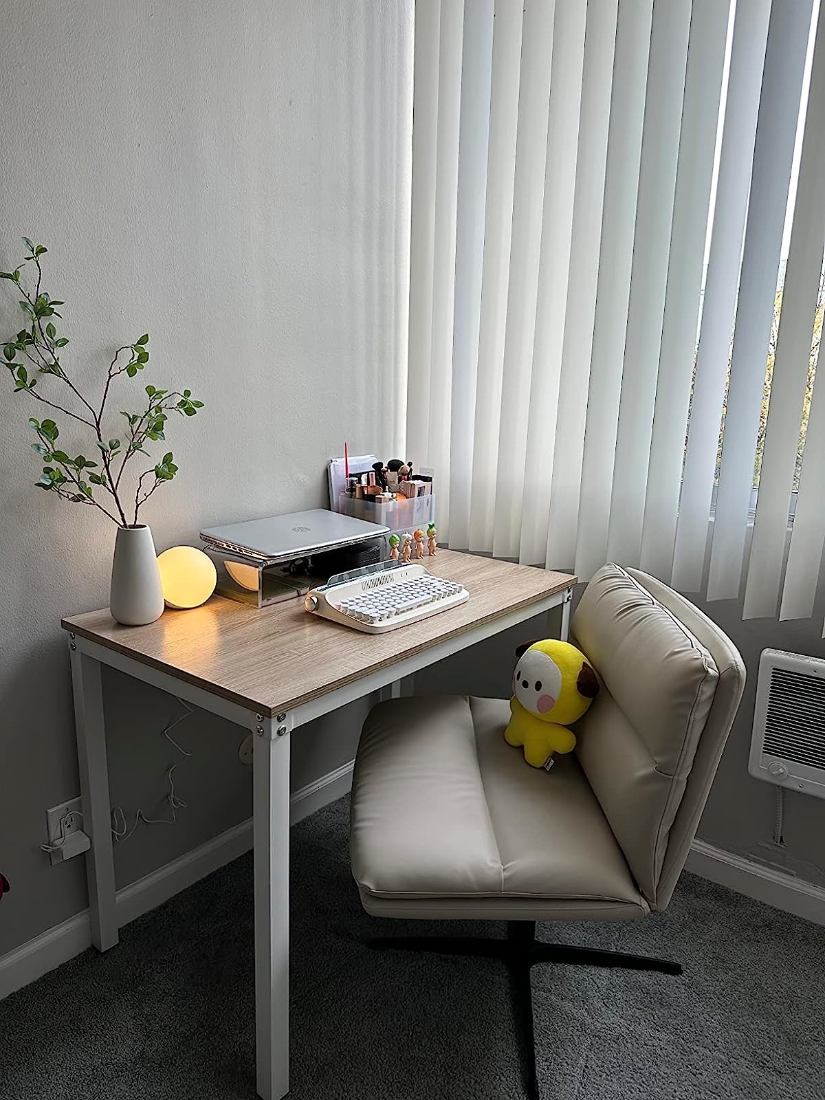 a reviewer photo of the tan office chair in a decorated office space