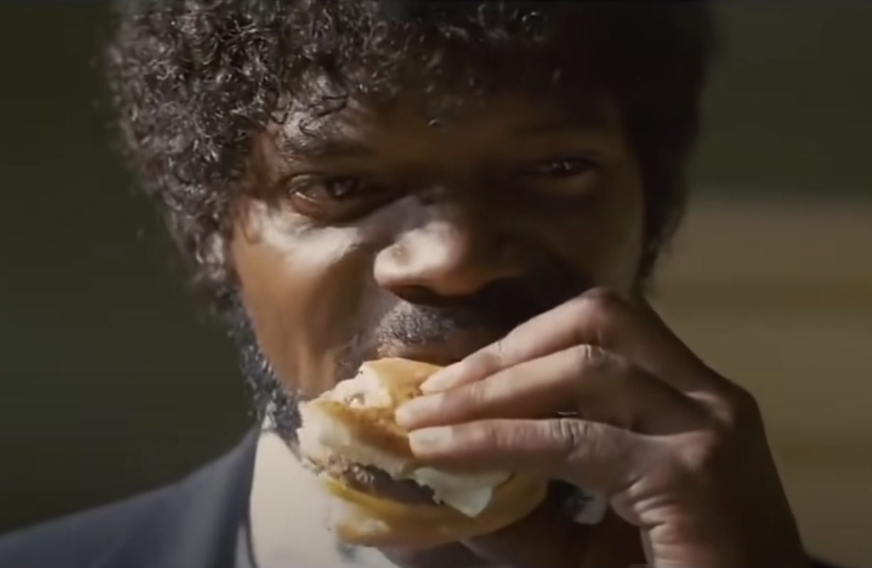 Close-up of Jules biting down on a burger in a scene from &quot;Pulp Fiction&quot;