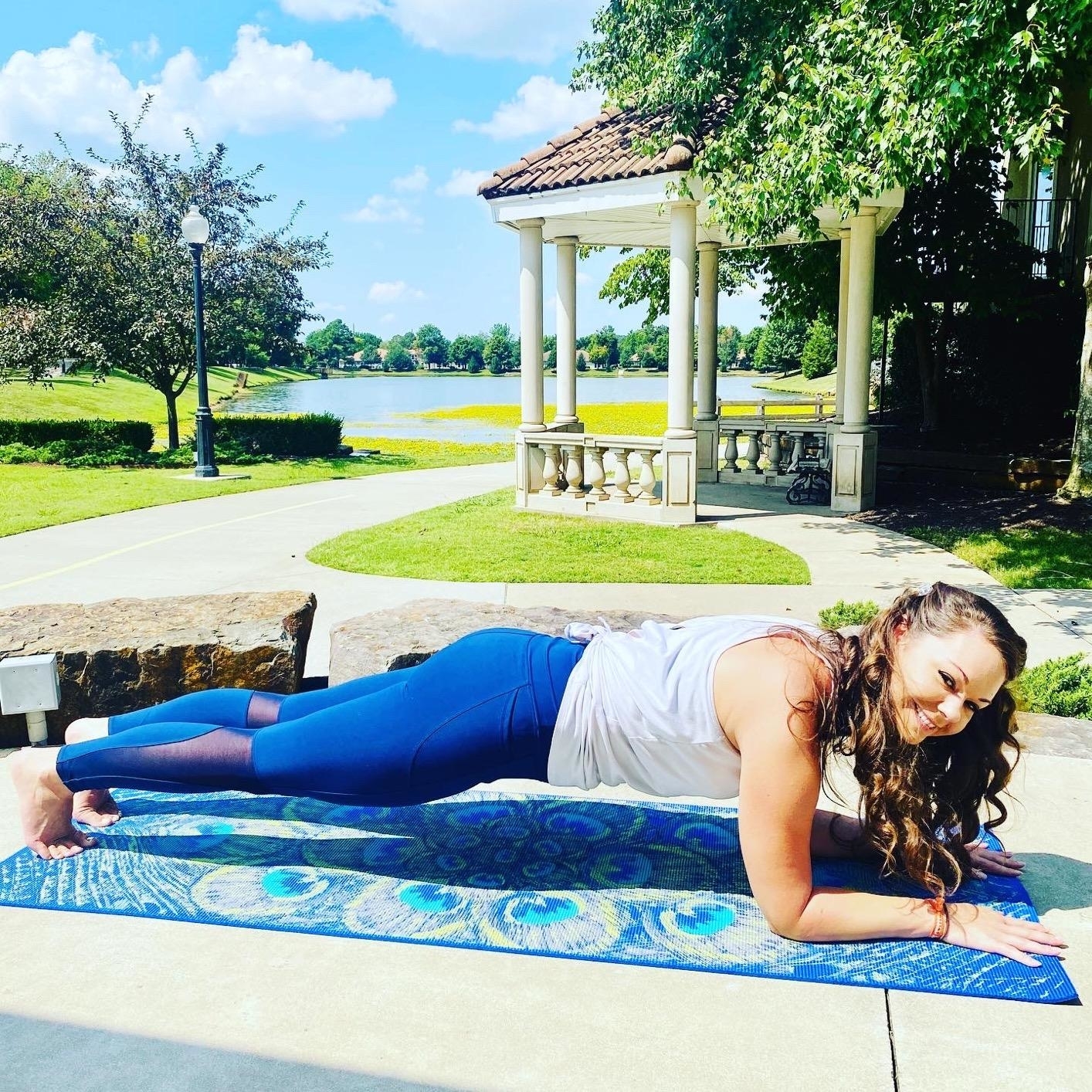 reviewer on a blue patterned yoga mat