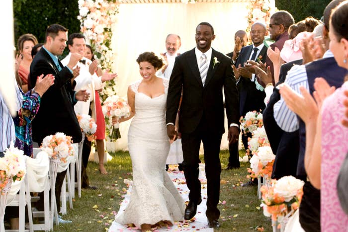 America Ferrera and Lance Gross walking down the aisle as husband and wife in Our Family Wedding