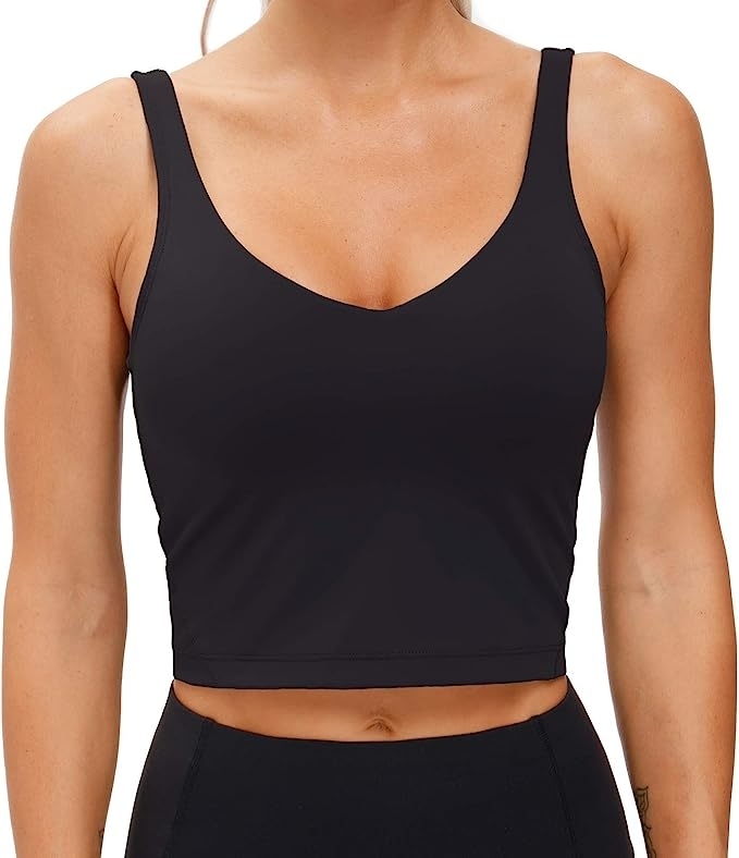 model wearing black longline sports bra
